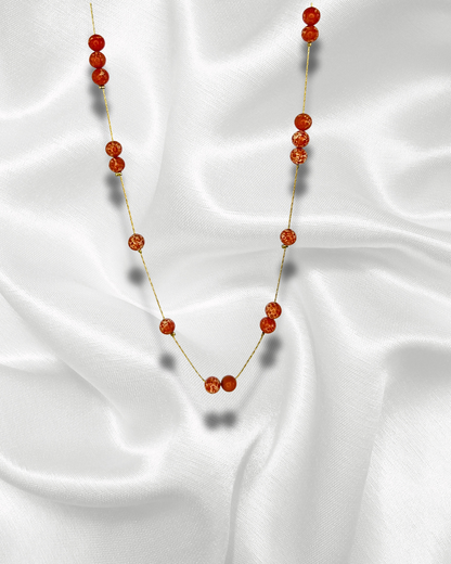 Terra | Collier doré orné de perles orangées