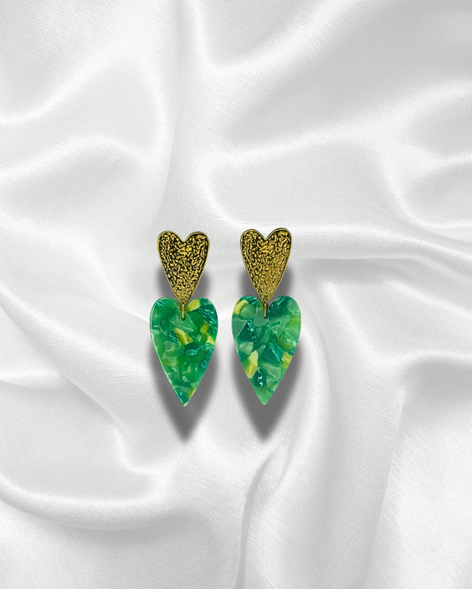 Calypso | Boucles d’oreilles dorées avec cœurs pendants